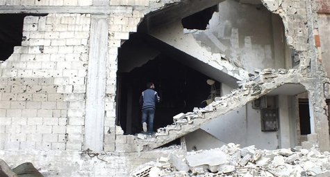 A man is seen on a damaged staircase in Homs, May 19, 2013. REUTERS/Yazen Homsy A man is seen on a damaged staircase in Homs, May 19, 2013. REUTERS/Yazen Homsy