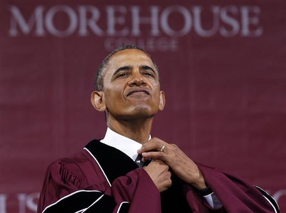 U.S. President Barack Obama adjusts his tie before receiving an honorary Doctor of Laws degree at the graduation ceremony of the class of 20 U.S. President Barack Obama adjusts his tie before receiving an honorary Doctor of Laws degree at the graduation ceremony of the class of 20