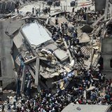 People rescue garment workers trapped under rubble at the Rana Plaza building after it collapsed, in Savar, 30 km (19 miles) outside Dhaka, People rescue garment workers trapped under rubble at the Rana Plaza building after it collapsed, in Savar, 30 km (19 miles) outside Dhaka,