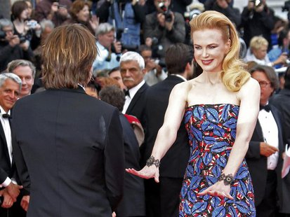Jury member actress Nicole Kidman (R) and her husband Keith Urban pose on the red carpet as they arrive for the screening of the film "Insid Jury member actress Nicole Kidman (R) and her husband Keith Urban pose on the red carpet as they arrive for the screening of the film "Insid