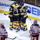 Boston Bruins' players celebrate after scoring against New York Rangers goaltender Henrik Lundqvist (R) and Rangers right wing Mats Zuccarel Boston Bruins' players celebrate after scoring against New York Rangers goaltender Henrik Lundqvist (R) and Rangers right wing Mats Zuccarel