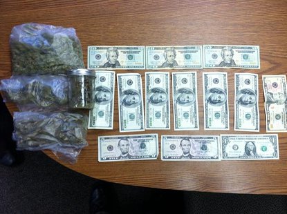 Drugs and cash seized from van during weekend traffic stop. Drugs and cash seized from van during weekend traffic stop.