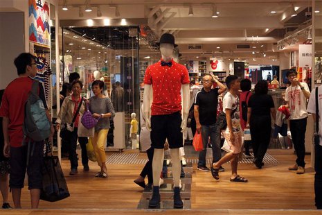 Shoppers walk inside flagship store of Japanese fashion house Uniqlo at Hong Kong's Causeway Bay shopping district May 9, 2013. REUTERS/Bobb Shoppers walk inside flagship store of Japanese fashion house Uniqlo at Hong Kong's Causeway Bay shopping district May 9, 2013. REUTERS/Bobb