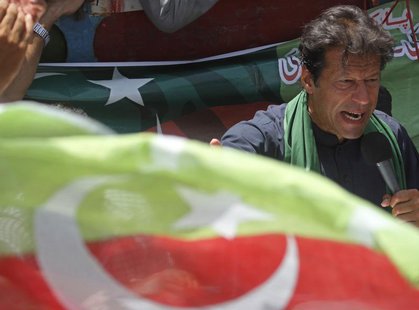 Imran Khan, Pakistani cricketer-turned-politician and chairman of political party Pakistan Tehreek-e-Insaf (PTI), addresses his supporters a Imran Khan, Pakistani cricketer-turned-politician and chairman of political party Pakistan Tehreek-e-Insaf (PTI), addresses his supporters a