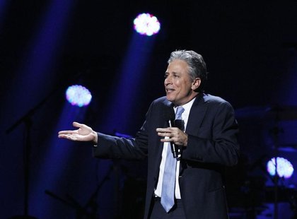 Comedian Jon Stewart speaks during the "12-12-12" benefit concert for victims of Superstorm Sandy at Madison Square Garden in New York Decem Comedian Jon Stewart speaks during the "12-12-12" benefit concert for victims of Superstorm Sandy at Madison Square Garden in New York Decem