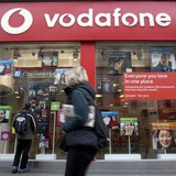 A pedestrian passes a Vodafone store on Oxford Street in central London, November 10, 2009. REUTERS/Kevin Coombs A pedestrian passes a Vodafone store on Oxford Street in central London, November 10, 2009. REUTERS/Kevin Coombs