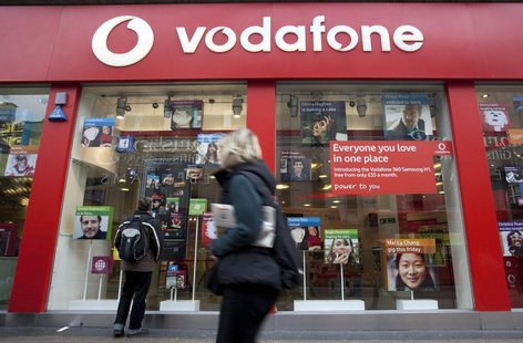 A pedestrian passes a Vodafone store on Oxford Street in central London, November 10, 2009. REUTERS/Kevin Coombs A pedestrian passes a Vodafone store on Oxford Street in central London, November 10, 2009. REUTERS/Kevin Coombs