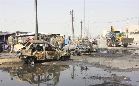 Residents gather at the site of a bomb attack in Basra, 420 km (260 miles) southeast of Baghdad, May 20, 2013. REUTERS/Atef Hassan Residents gather at the site of a bomb attack in Basra, 420 km (260 miles) southeast of Baghdad, May 20, 2013. REUTERS/Atef Hassan