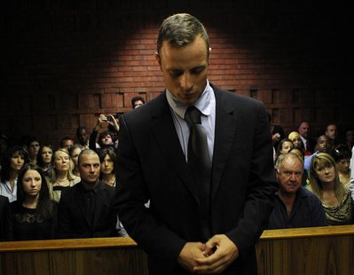 Oscar Pistorius stands in the dock ahead of court proceedings at the Pretoria magistrates court February 22, 2013. REUTERS/Siphiwe Sibeko Oscar Pistorius stands in the dock ahead of court proceedings at the Pretoria magistrates court February 22, 2013. REUTERS/Siphiwe Sibeko