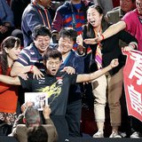 China's Zhang Jike (C) reacts among family members after defeating his compatriot Wang Hao in the men's singles final at the World Team Tabl China's Zhang Jike (C) reacts among family members after defeating his compatriot Wang Hao in the men's singles final at the World Team Tabl