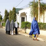 Women walk in a street in a residential area in Maiduguri, Borno State May 19, 2013, an area where President Goodluck Jonathan has declared Women walk in a street in a residential area in Maiduguri, Borno State May 19, 2013, an area where President Goodluck Jonathan has declared