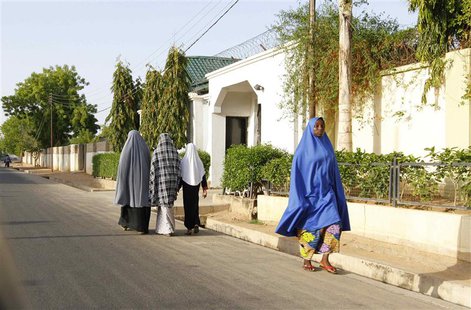 Women walk in a street in a residential area in Maiduguri, Borno State May 19, 2013, an area where President Goodluck Jonathan has declared Women walk in a street in a residential area in Maiduguri, Borno State May 19, 2013, an area where President Goodluck Jonathan has declared