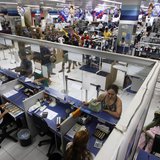 People wait in line at a branch of Bradesco bank, inside a Casas Bahia store in Sao Paulo February 18, 2013. REUTERS/ Nacho Doce People wait in line at a branch of Bradesco bank, inside a Casas Bahia store in Sao Paulo February 18, 2013. REUTERS/ Nacho Doce