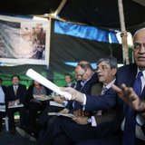 Saeb Erekat (R), a Palestinian senior politician and chief negotiator speaks during a visit to a tent set-up in protest against the construc Saeb Erekat (R), a Palestinian senior politician and chief negotiator speaks during a visit to a tent set-up in protest against the construc