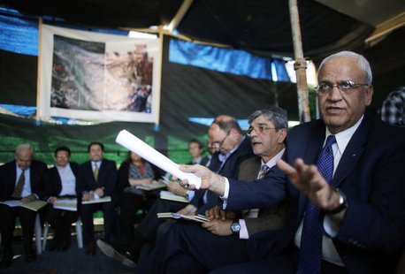 Saeb Erekat (R), a Palestinian senior politician and chief negotiator speaks during a visit to a tent set-up in protest against the construc Saeb Erekat (R), a Palestinian senior politician and chief negotiator speaks during a visit to a tent set-up in protest against the construc