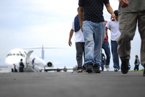 Illegal immigrants from El Salvador arrive at the Comalapa international airport after being deported from the U.S. in Comalapa, on the outs Illegal immigrants from El Salvador arrive at the Comalapa international airport after being deported from the U.S. in Comalapa, on the outs
