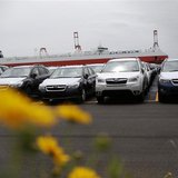 Newly produced cars ready for shipment are parked at a port in Yokohama, south of Tokyo May 21, 2013. REUTERS/Toru Hanai Newly produced cars ready for shipment are parked at a port in Yokohama, south of Tokyo May 21, 2013. REUTERS/Toru Hanai
