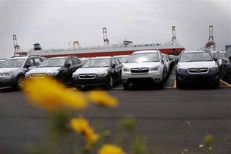Newly produced cars ready for shipment are parked at a port in Yokohama, south of Tokyo May 21, 2013. REUTERS/Toru Hanai Newly produced cars ready for shipment are parked at a port in Yokohama, south of Tokyo May 21, 2013. REUTERS/Toru Hanai