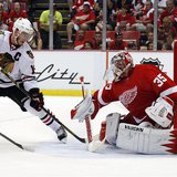 Detroit Red Wings goalie Jimmy Howard (35) makes a save on Chicago Blackhawks center Jonathan Toews (19) in the 2nd period of Game 3 of thei Detroit Red Wings goalie Jimmy Howard (35) makes a save on Chicago Blackhawks center Jonathan Toews (19) in the 2nd period of Game 3 of thei