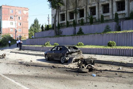 Police and investigators work at the scene of a blast in Makhachkala May 20, 2013. REUTERS/Abdula Magomedov/NewsTeam Police and investigators work at the scene of a blast in Makhachkala May 20, 2013. REUTERS/Abdula Magomedov/NewsTeam