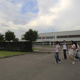 Employees walk outside of the Denso (Guangzhou Nansha) Co Ltd plant in Nansha, Guangdong province June 22, 2010. REUTERS/Tyrone Siu Employees walk outside of the Denso (Guangzhou Nansha) Co Ltd plant in Nansha, Guangdong province June 22, 2010. REUTERS/Tyrone Siu