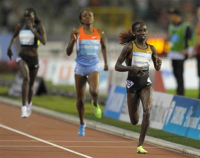 Vivian Cheruiyot of Kenya (R) competes in the women's 5000m event at the IAAF Diamond League athletics meeting, also known as Memorial Van D Vivian Cheruiyot of Kenya (R) competes in the women's 5000m event at the IAAF Diamond League athletics meeting, also known as Memorial Van D