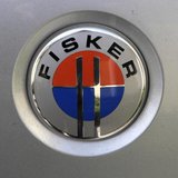 The logo of an extended rage electric vehicle Fisker Karma is pictured at the start of an electric car rally from Tallinn to Monte-Carlo in The logo of an extended rage electric vehicle Fisker Karma is pictured at the start of an electric car rally from Tallinn to Monte-Carlo in