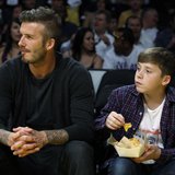 Soccer star David Beckham (L) and his son Brooklyn watch the Los Angeles Lakers play the Denver Nuggets during Game 1 of their first round N Soccer star David Beckham (L) and his son Brooklyn watch the Los Angeles Lakers play the Denver Nuggets during Game 1 of their first round N