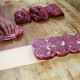 Clayton Colliou, a meat cutter at Bon Ton Meat Market, cuts choice cuts of Alberta beef in Calgary, Alberta in this October 3, 2012 file pho Clayton Colliou, a meat cutter at Bon Ton Meat Market, cuts choice cuts of Alberta beef in Calgary, Alberta in this October 3, 2012 file pho