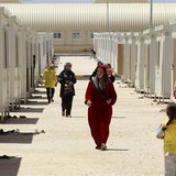 Syrian refugees walk inside the Mrajeeb Al Fhood refugee camp, 20 km (12.4 miles) east of the city of Zarqa April 29, 2013. REUTERS/Muhammad Syrian refugees walk inside the Mrajeeb Al Fhood refugee camp, 20 km (12.4 miles) east of the city of Zarqa April 29, 2013. REUTERS/Muhammad