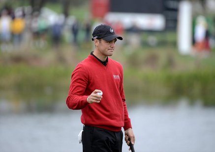 Martin Kaymer of Germany waves his ball to the fans during first round play in the Honda Classic PGA golf tournament in Palm Beach Gardens, Martin Kaymer of Germany waves his ball to the fans during first round play in the Honda Classic PGA golf tournament in Palm Beach Gardens,