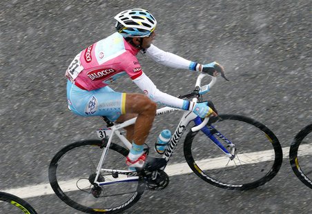 Italy's Vincenzo Nibali climbs during the 146km (91 miles) 15th stage of the Giro d'Italia, from Cesana to Col du Galibier May 19, 2013. REU Italy's Vincenzo Nibali climbs during the 146km (91 miles) 15th stage of the Giro d'Italia, from Cesana to Col du Galibier May 19, 2013. REU