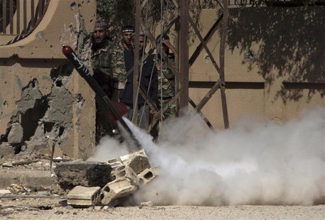 Free Syrian Army fighters react during the firing of a rocket towards forces loyal to Syria's President Bashar al-Assad in Deir al-Zor May 1 Free Syrian Army fighters react during the firing of a rocket towards forces loyal to Syria's President Bashar al-Assad in Deir al-Zor May 1