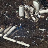 Investigators stand amid the aftermath of a massive explosion at a fertilizer plant in the town of West, near Waco, Texas April 18, 2013. RE Investigators stand amid the aftermath of a massive explosion at a fertilizer plant in the town of West, near Waco, Texas April 18, 2013. RE