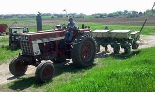 Ervin Van Camp heads out to the field in the Outagamie County town of Center, May 21, 2013. (courtesy of FOX 11).
