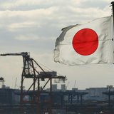 A Japanese flag flutters in front of a shipping container area, at a port in Tokyo December 19, 2012. REUTERS/Yuriko Nakao A Japanese flag flutters in front of a shipping container area, at a port in Tokyo December 19, 2012. REUTERS/Yuriko Nakao