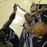San Antonio Spurs forward Tim Duncan goes up for the shot as he is defended by Memphis Grizzlies forward Zach Randolph and center Marc Gasol San Antonio Spurs forward Tim Duncan goes up for the shot as he is defended by Memphis Grizzlies forward Zach Randolph and center Marc Gasol
