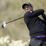 Spanish golfer Sergio Garcia hits off the 17th tee against Thailand's Thongchai Jaidee during the weather delayed first round of the WGC-Acc Spanish golfer Sergio Garcia hits off the 17th tee against Thailand's Thongchai Jaidee during the weather delayed first round of the WGC-Acc