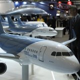A visitor looks at replica aircrafts on the Airbus booth during the Annual European Business Aviation Convention & Exhibition (EBACE) at Coi A visitor looks at replica aircrafts on the Airbus booth during the Annual European Business Aviation Convention & Exhibition (EBACE) at Coi