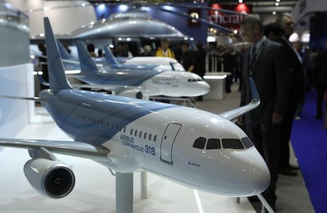 A visitor looks at replica aircrafts on the Airbus booth during the Annual European Business Aviation Convention & Exhibition (EBACE) at Coi A visitor looks at replica aircrafts on the Airbus booth during the Annual European Business Aviation Convention & Exhibition (EBACE) at Coi
