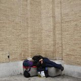 A homeless man sleeps in front of Saint Peter's Square in Rome March 7, 2013. REUTERS/Max Rossi A homeless man sleeps in front of Saint Peter's Square in Rome March 7, 2013. REUTERS/Max Rossi