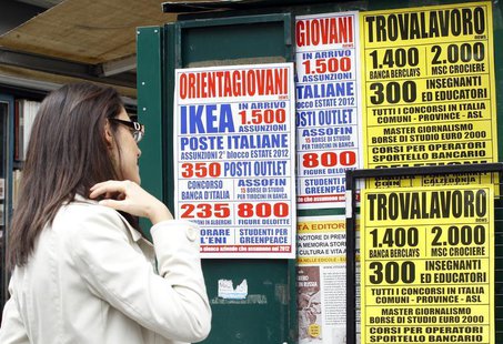 A woman checks job offers in downtown Milan April 3, 2012. REUTERS/Alessandro Garofalo A woman checks job offers in downtown Milan April 3, 2012. REUTERS/Alessandro Garofalo