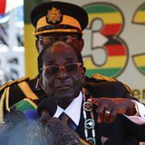 Zimbabwe's President Robert Mugabe addresses crowds gathered for the country's 33rd independence celebrations at the National Sports stadium Zimbabwe's President Robert Mugabe addresses crowds gathered for the country's 33rd independence celebrations at the National Sports stadium