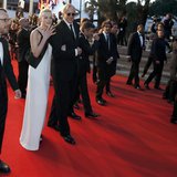 Director Ethan Coen (L), cast member Carey Mulligan (2ndL), musician T-Bone Burnett (3rdL) walk on the red carpet as they leave after the sc Director Ethan Coen (L), cast member Carey Mulligan (2ndL), musician T-Bone Burnett (3rdL) walk on the red carpet as they leave after the sc