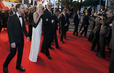 Director Ethan Coen (L), cast member Carey Mulligan (2ndL), musician T-Bone Burnett (3rdL) walk on the red carpet as they leave after the sc Director Ethan Coen (L), cast member Carey Mulligan (2ndL), musician T-Bone Burnett (3rdL) walk on the red carpet as they leave after the sc