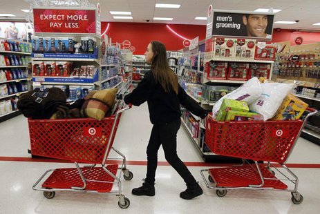 A woman pulls shopping carts through the aisle of a Target store on the shopping day dubbed "Black Friday" in Torrington, Connecticut Novemb A woman pulls shopping carts through the aisle of a Target store on the shopping day dubbed "Black Friday" in Torrington, Connecticut Novemb