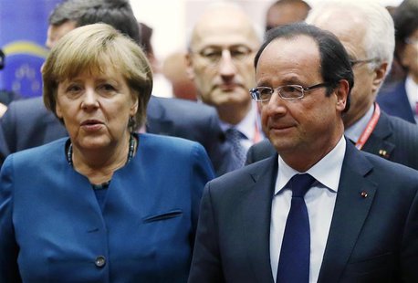 Germany's Chancellor Angela Merkel and France's President Francois Hollande (R) arrive at a European Union leaders summit in Brussels May 22 Germany's Chancellor Angela Merkel and France's President Francois Hollande (R) arrive at a European Union leaders summit in Brussels May 22