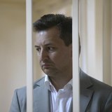 Vladimir Golubkov, the head of Societe Generale's Russian unit Rosbank, looks out from a holding cell during a court hearing in Moscow May 1 Vladimir Golubkov, the head of Societe Generale's Russian unit Rosbank, looks out from a holding cell during a court hearing in Moscow May 1