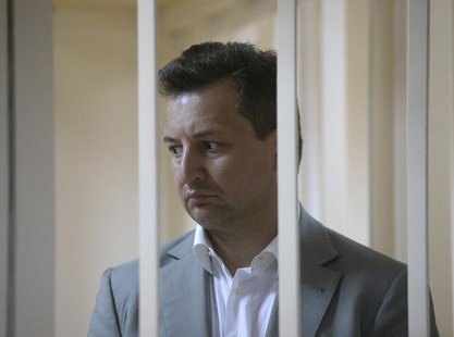 Vladimir Golubkov, the head of Societe Generale's Russian unit Rosbank, looks out from a holding cell during a court hearing in Moscow May 1 Vladimir Golubkov, the head of Societe Generale's Russian unit Rosbank, looks out from a holding cell during a court hearing in Moscow May 1