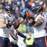 Chicago Bears line backer Brian Urlacher (54) celebrates with defensive end Julius Peppers (90) after recovering a fumble in the first half Chicago Bears line backer Brian Urlacher (54) celebrates with defensive end Julius Peppers (90) after recovering a fumble in the first half